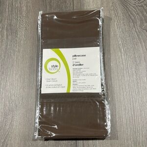 New pair brown pillowcases in package plus three extra (not new)